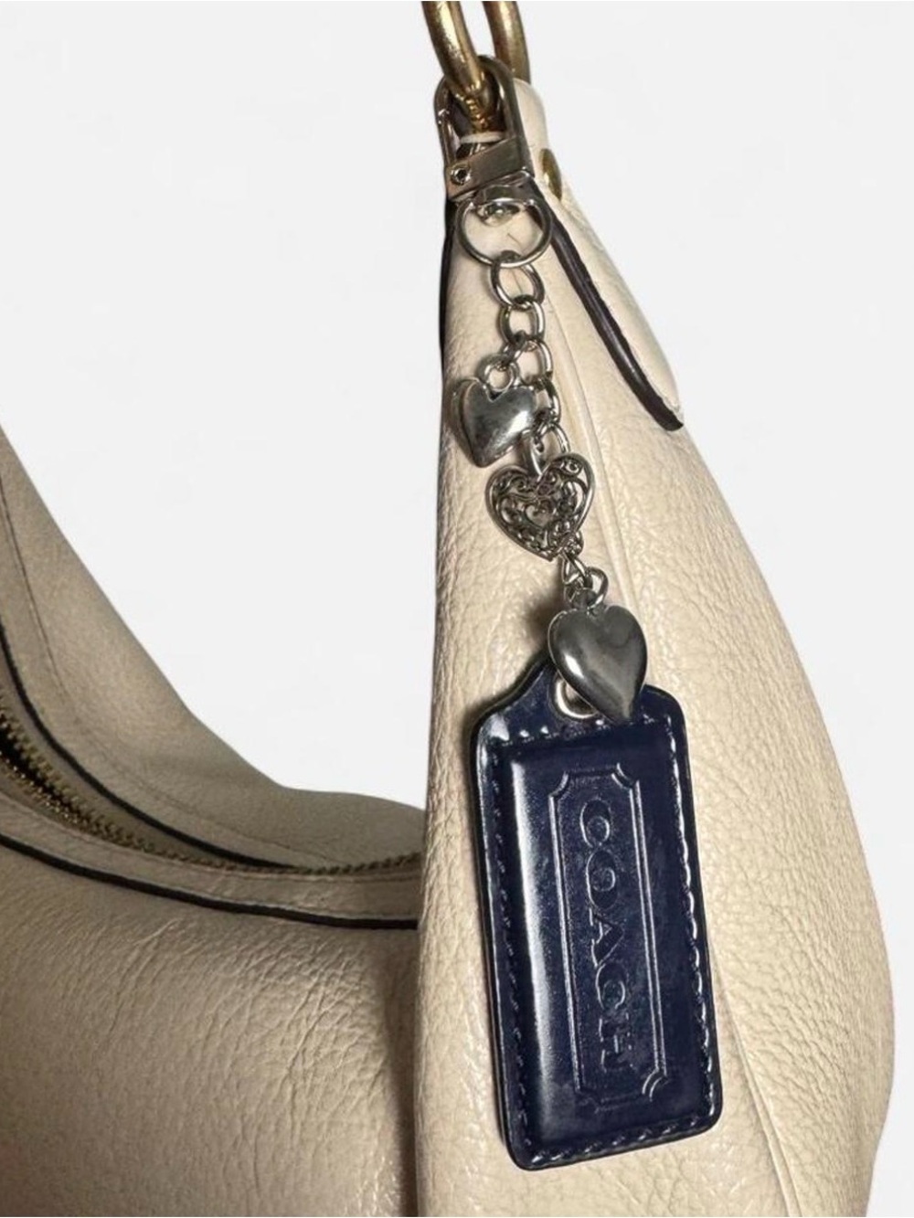 COACH navy blue hangtag keychain with heart charms